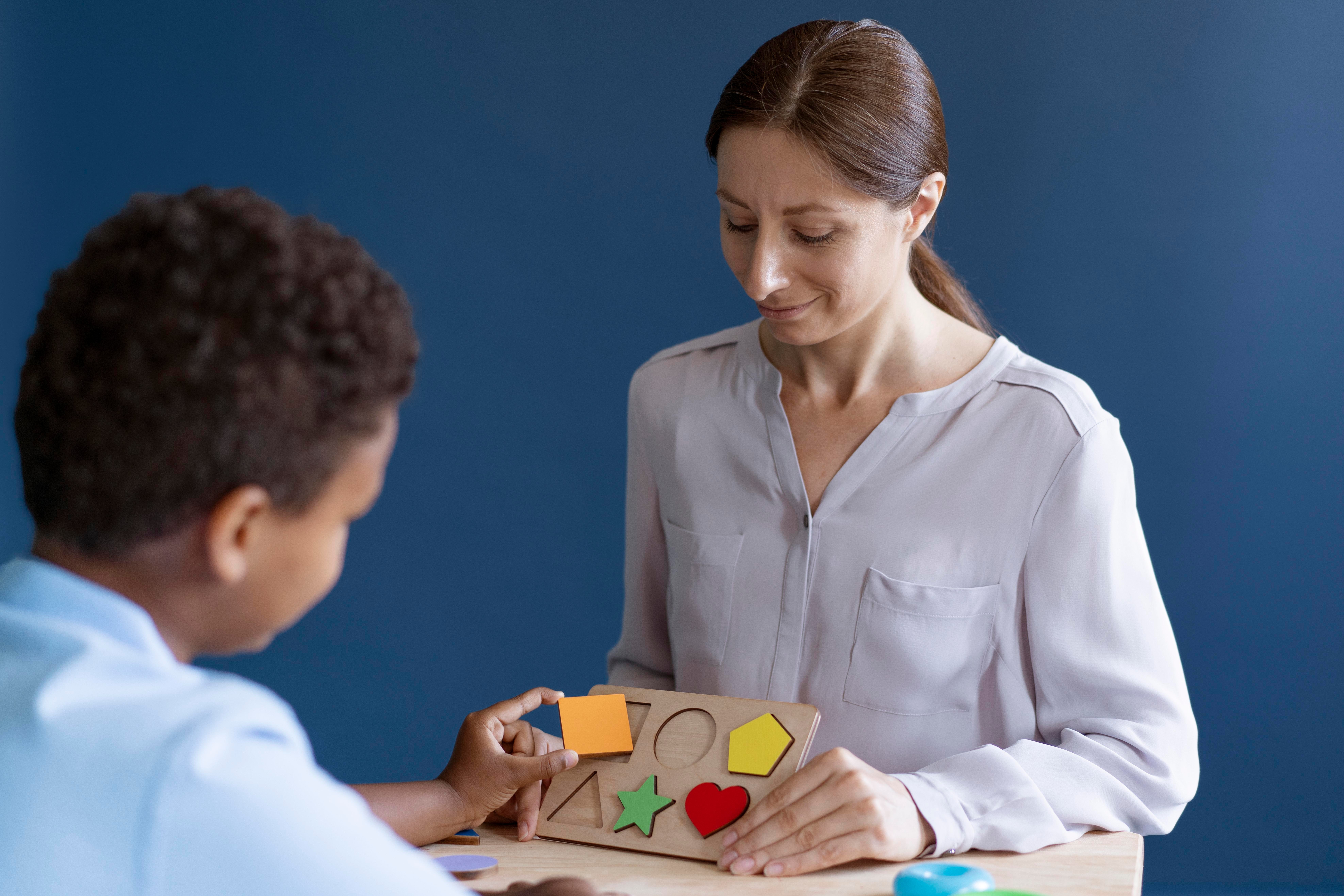 kid-doing-occupational-therapy-session-with-psychologist